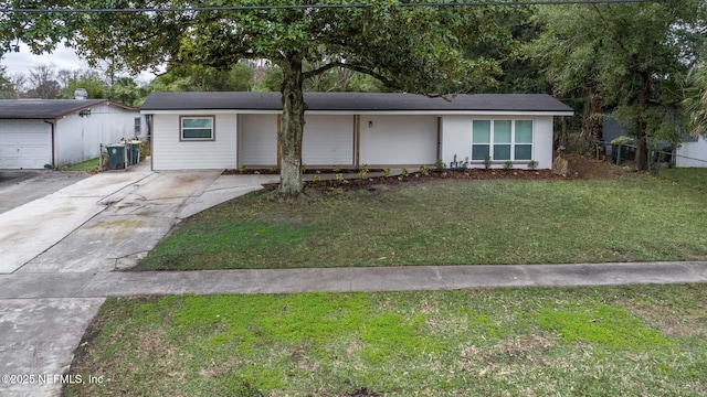 10856 Hawaii Dr S, Jacksonville, FL 32246 - ranch-style house with driveway and a front yard