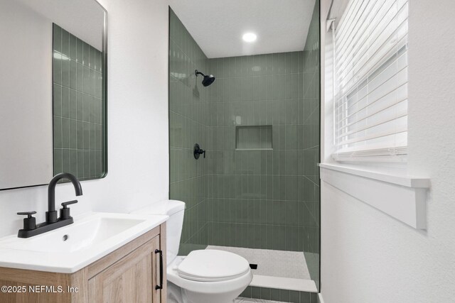 10856 Hawaii Dr S, Jacksonville, FL 32246 - bathroom featuring vanity, a walk in shower, and toilet