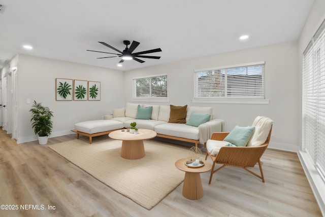 10856 Hawaii Dr S, Jacksonville, FL 32246 - living area with light wood-style floors, ceiling fan, recessed lighting, and a healthy amount of sunlight