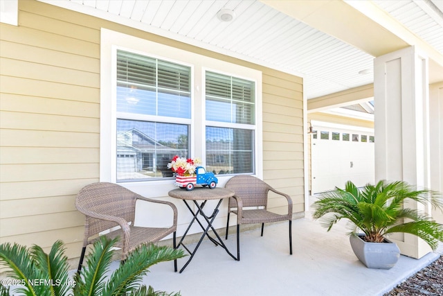 53 Dovetail Cir, Saint Augustine, FL 32095 - view of patio featuring a porch and a garage