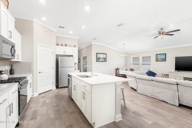 53 Dovetail Cir, Saint Augustine, FL 32095 - kitchen featuring visible vents, open floor plan, a sink, ceiling fan with notable chandelier, and stainless steel appliances