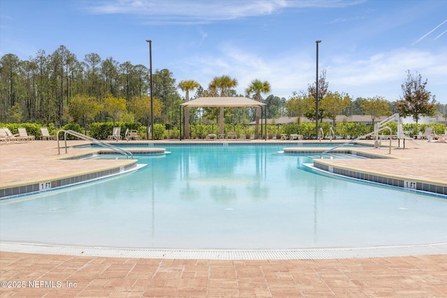 53 Dovetail Cir, Saint Augustine, FL 32095 - pool featuring a patio and a jacuzzi