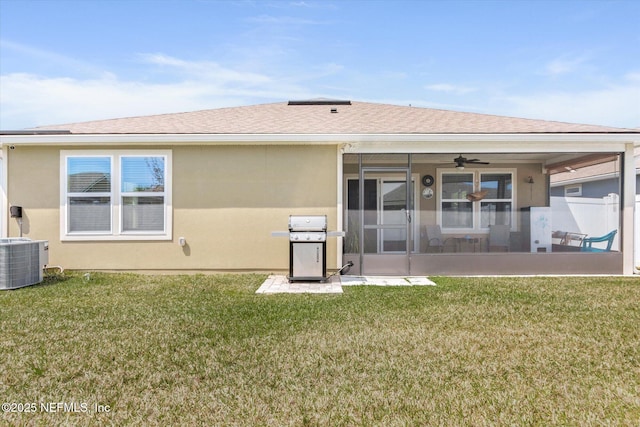 53 Dovetail Cir, Saint Augustine, FL 32095 - back of house featuring a sunroom, a ceiling fan, a lawn, and central AC