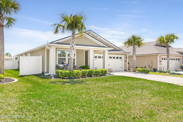 53 Dovetail Cir, Saint Augustine, FL 32095 - view of front of home featuring fence, driveway, a front lawn, and a garage