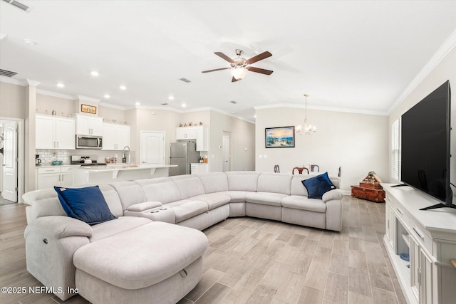 53 Dovetail Cir, Saint Augustine, FL 32095 - living room featuring recessed lighting, light wood-style floors, ceiling fan with notable chandelier, and visible vents
