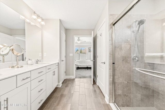 53 Dovetail Cir, Saint Augustine, FL 32095 - full bath with connected bathroom, vanity, a ceiling fan, baseboards, and a stall shower