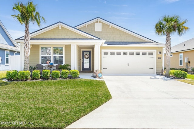 53 Dovetail Cir, Saint Augustine, FL 32095 - craftsman inspired home featuring a porch, an attached garage, driveway, and a front lawn