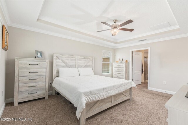 53 Dovetail Cir, Saint Augustine, FL 32095 - bedroom with light carpet, a raised ceiling, baseboards, visible vents, and ornamental molding