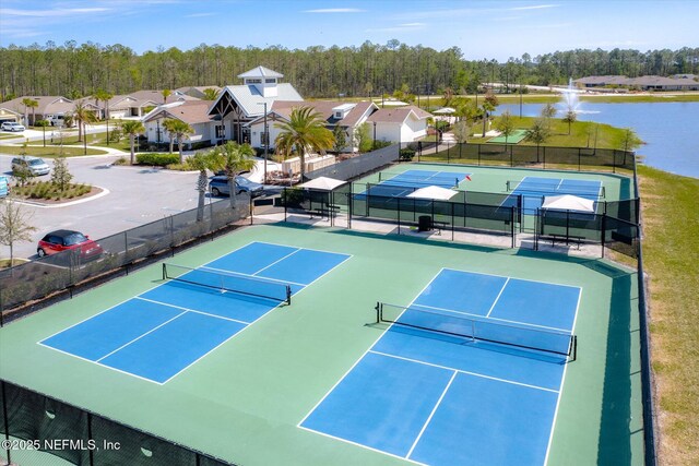 53 Dovetail Cir, Saint Augustine, FL 32095 - view of sport court with fence and a water view