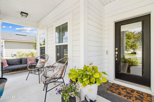 property entrance featuring covered porch