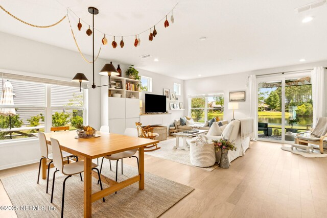 dining room featuring light wood-style floors, recessed lighting, and visible vents