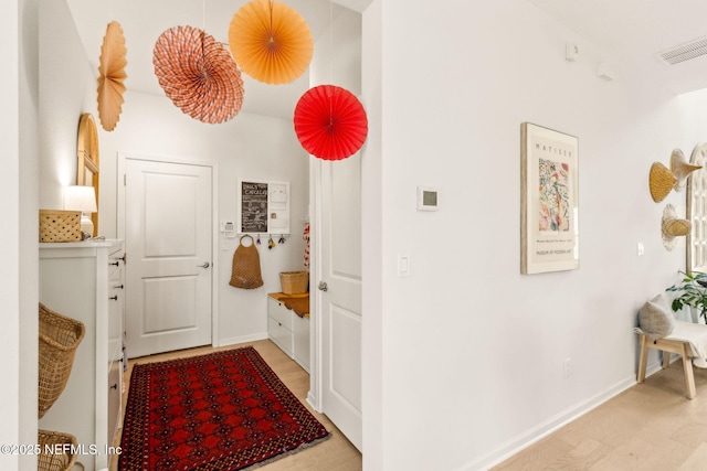 mudroom with baseboards and visible vents