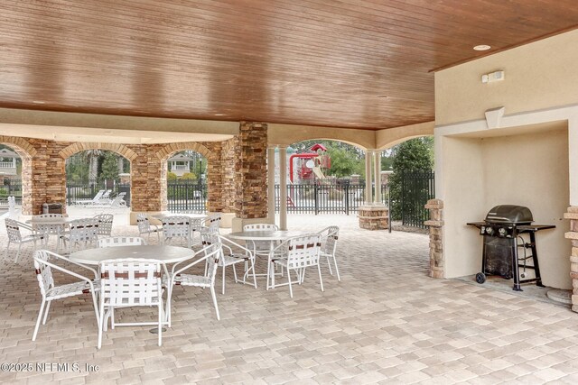 view of patio / terrace with fence, outdoor dining space, and area for grilling