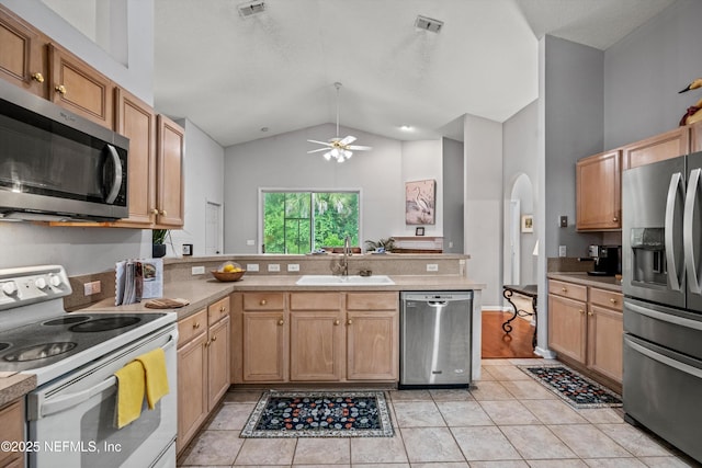 1105 Pine Mill Ln, Ponte Vedra Beach, FL 32082 - kitchen featuring stainless steel appliances, a sink, a peninsula, a ceiling fan, and light tile patterned flooring