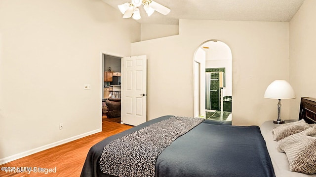 1105 Pine Mill Ln, Ponte Vedra Beach, FL 32082 - bedroom featuring arched walkways, wood finished floors, lofted ceiling, baseboards, and a ceiling fan