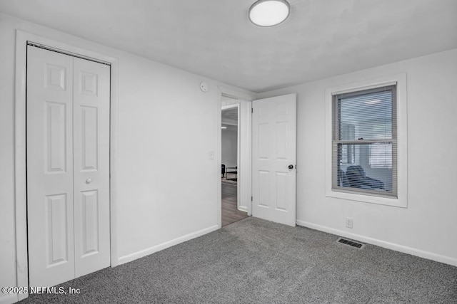 1059 Little Ruth Rd, Green Cove Springs, FL 32043 - unfurnished bedroom with baseboards, visible vents, carpet, and a closet