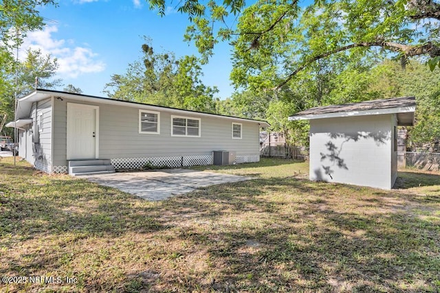 1059 Little Ruth Rd, Green Cove Springs, FL 32043 - rear view of property featuring fence, cooling unit, an outdoor structure, a yard, and entry steps