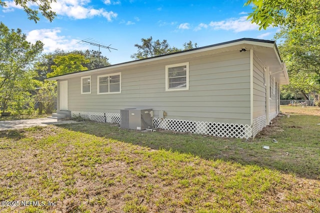 1059 Little Ruth Rd, Green Cove Springs, FL 32043 - view of home's exterior featuring central AC, a yard, and entry steps