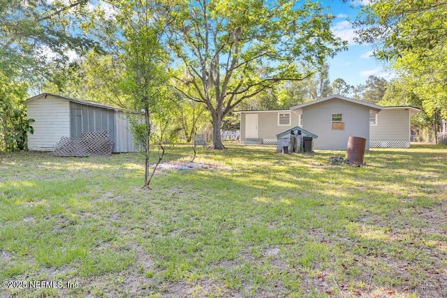 1059 Little Ruth Rd, Green Cove Springs, FL 32043 - view of yard featuring a storage unit and an outdoor structure