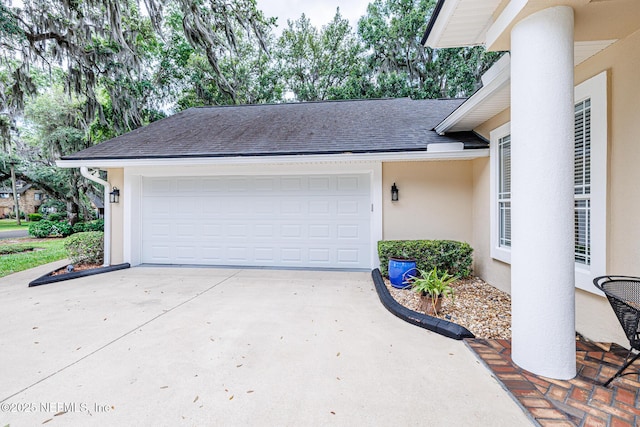 garage with concrete driveway