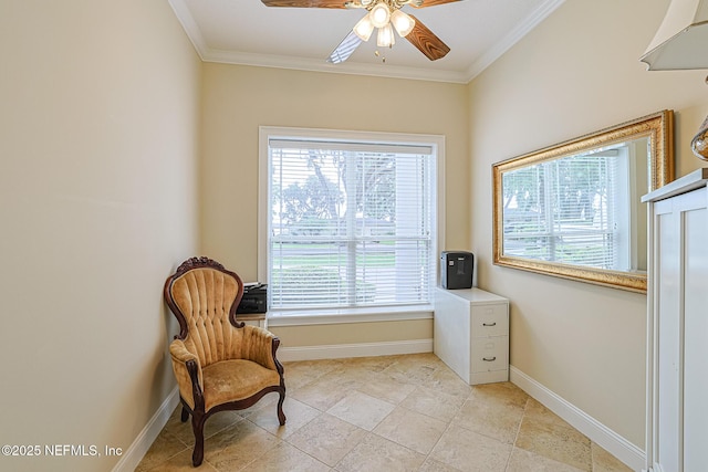 sitting room with baseboards, ceiling fan, plenty of natural light, and ornamental molding
