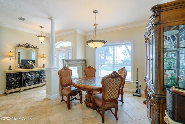 dining room with visible vents, baseboards, and ornate columns