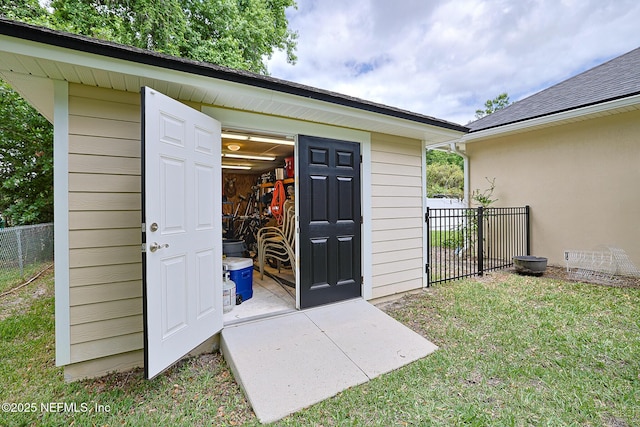 view of shed with fence