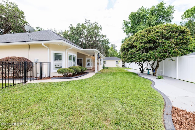 view of yard with a fenced backyard