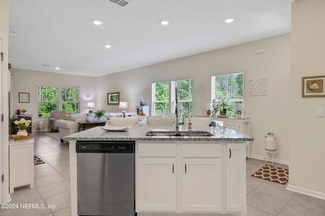 497 Coastline Way, Saint Augustine, FL 32092 - kitchen featuring dishwasher, a sink, open floor plan, an island with sink, and light stone counters