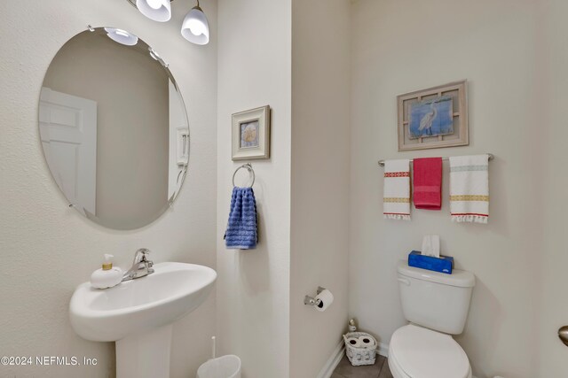 497 Coastline Way, Saint Augustine, FL 32092 - half bath with toilet, tile patterned floors, a sink, and baseboards