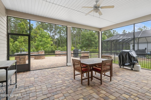 149 San Telmo Ct, Saint Augustine, FL 32095 - sunroom / solarium with outdoor dining space, an outdoor kitchen, and a ceiling fan