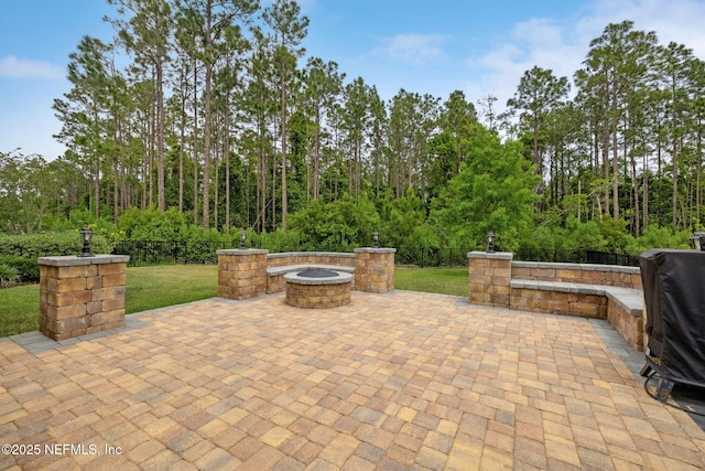 149 San Telmo Ct, Saint Augustine, FL 32095 - view of patio with a fenced backyard and a fire pit