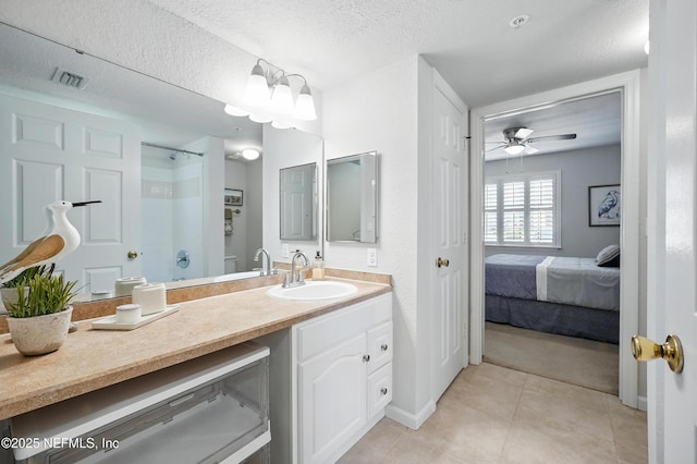 705 Boardwalk Dr Unit 411, Ponte Vedra Beach, FL 32082 - ensuite bathroom with visible vents, vanity, a shower, ceiling fan, and tile patterned floors