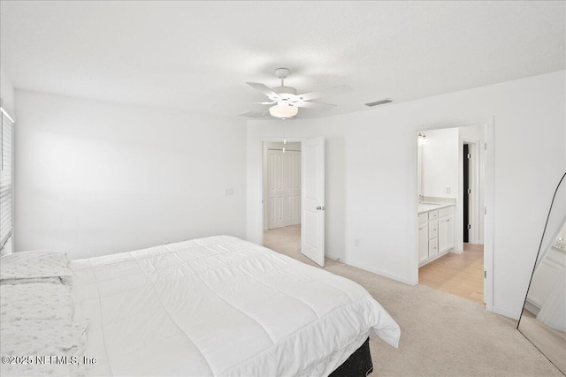 115 Beauclair Blvd, Saint Augustine, FL 32084 - bedroom featuring a ceiling fan, visible vents, baseboards, light carpet, and ensuite bath