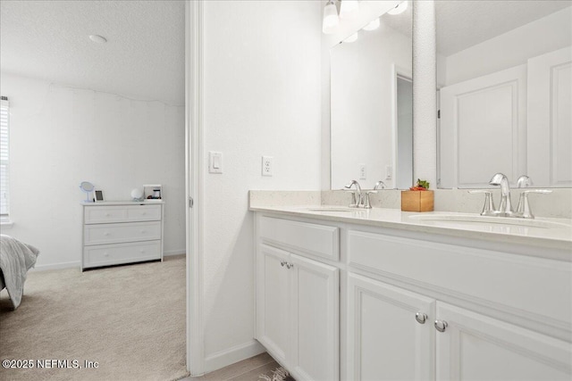 115 Beauclair Blvd, Saint Augustine, FL 32084 - bathroom featuring double vanity, a sink, and a textured ceiling
