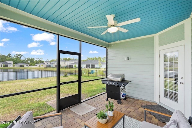 115 Beauclair Blvd, Saint Augustine, FL 32084 - sunroom with a water view, a ceiling fan, and a residential view