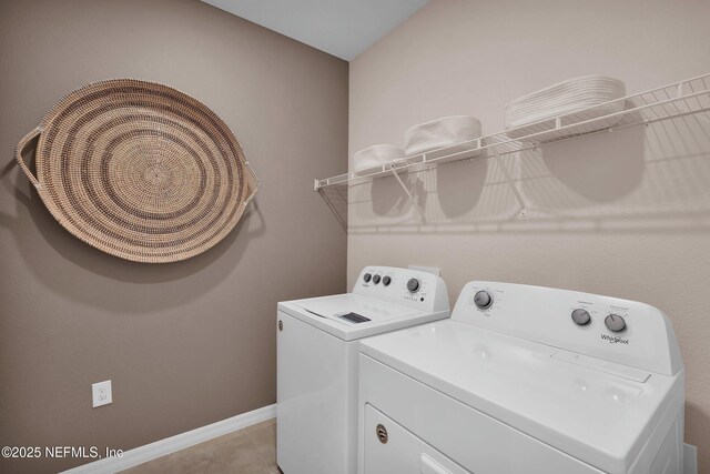 950 Rooster Hallow Way, Middleburg, FL 32068 - laundry area with baseboards, laundry area, light tile patterned flooring, and washer and dryer