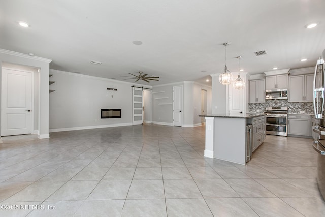 kitchen featuring crown molding, appliances with stainless steel finishes, gray cabinets, and visible vents