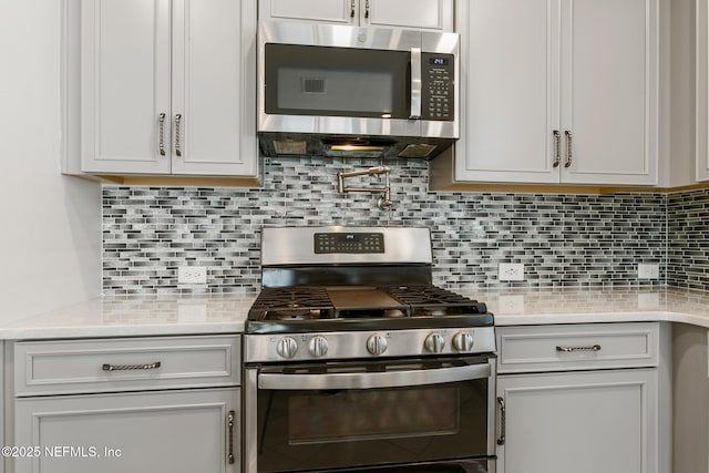 kitchen with decorative backsplash and stainless steel appliances