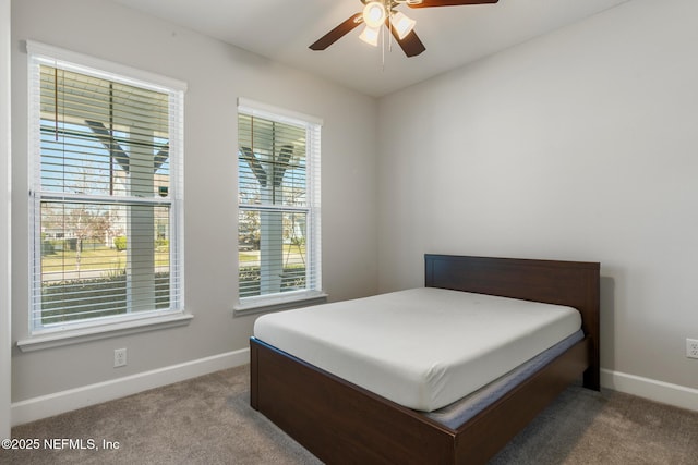 bedroom with baseboards, a ceiling fan, and carpet floors