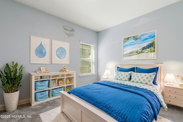 carpeted bedroom featuring baseboards