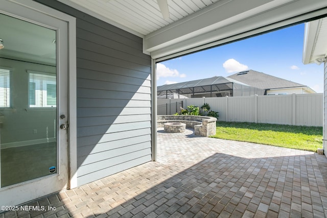 view of patio / terrace featuring a fenced backyard and an outdoor fire pit
