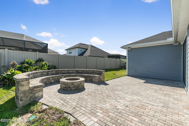 view of patio / terrace featuring a fenced backyard and an outdoor fire pit