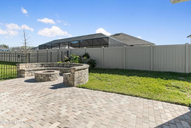 view of patio / terrace featuring a fenced backyard and a fire pit