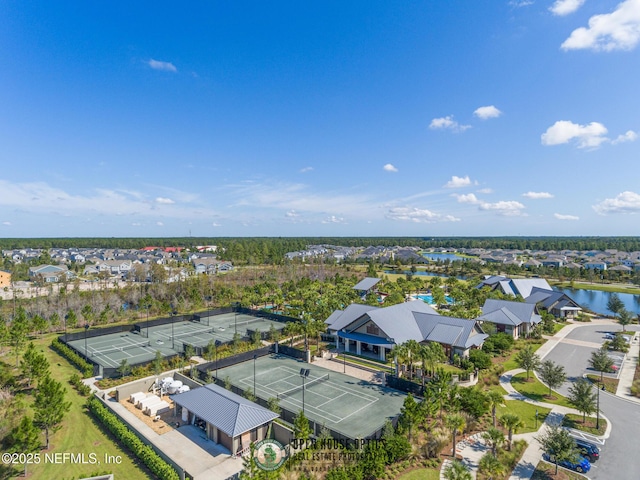birds eye view of property with a water view and a residential view
