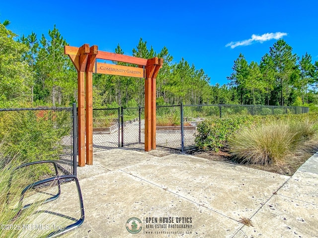 view of gate featuring fence