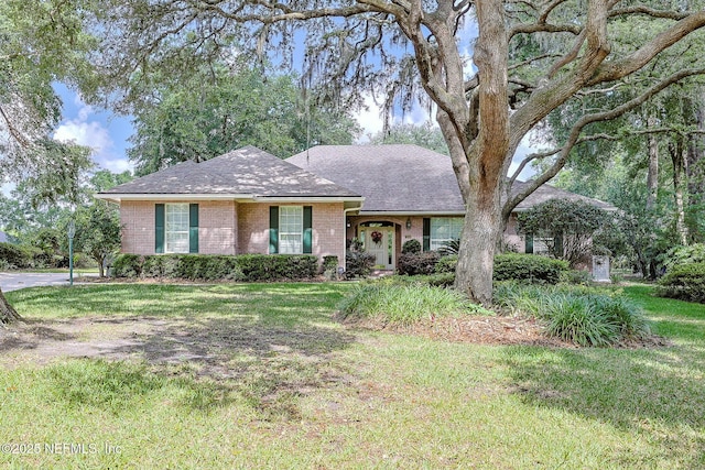 3666 Cypress Point Ct, Green Cove Springs, FL 32043 - ranch-style home featuring brick siding, a front yard, and a shingled roof