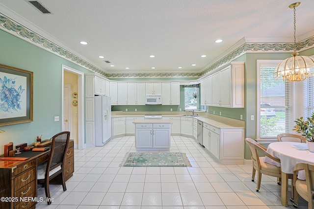 3666 Cypress Point Ct, Green Cove Springs, FL 32043 - kitchen with white appliances, a chandelier, crown molding, light countertops, and white cabinets
