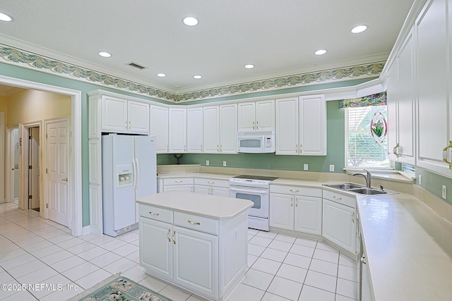 3666 Cypress Point Ct, Green Cove Springs, FL 32043 - kitchen with white appliances, a sink, light countertops, white cabinets, and ornamental molding