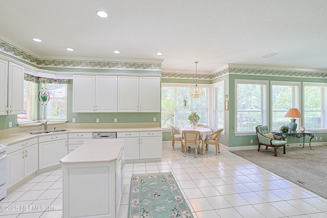 3666 Cypress Point Ct, Green Cove Springs, FL 32043 - kitchen featuring a sink, light countertops, baseboards, white cabinetry, and light tile patterned floors